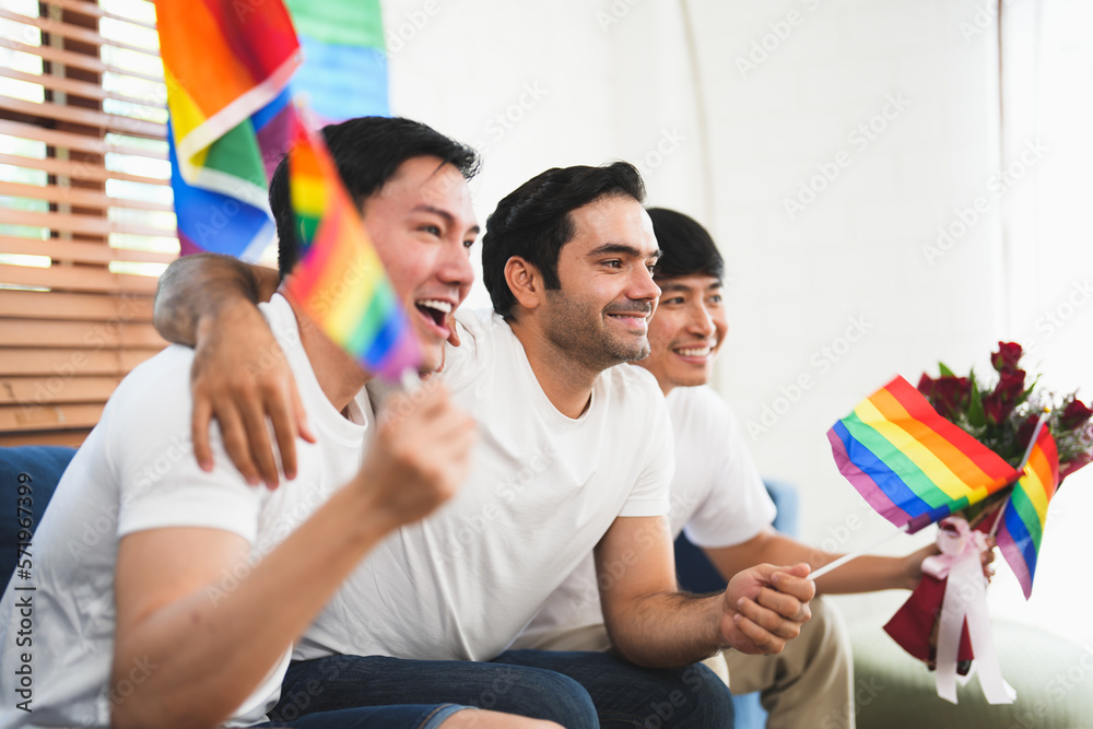 Triple young man sitting in the living room while celebrating valentine's day together. LGBTQ people lifestyle and love emotion.