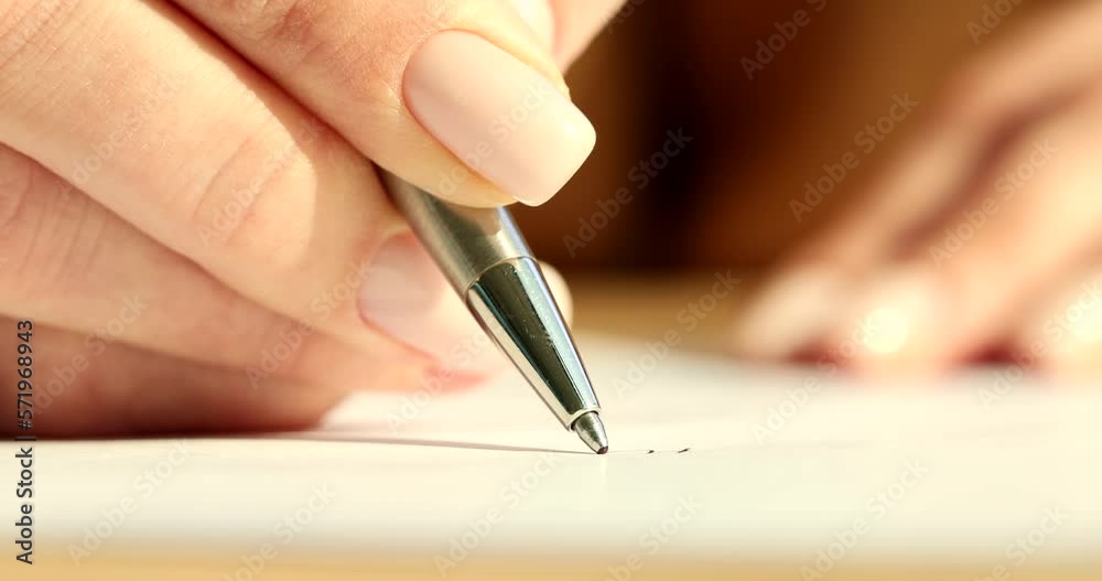 Hands of client signing car rental or employment contract form Hands of client signing car rental or employment contract form