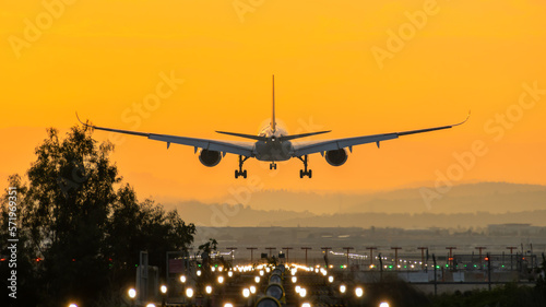 Airbus A350 landing into the sunrise photo