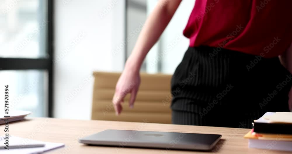 Businesswoman manager sit down at table in office