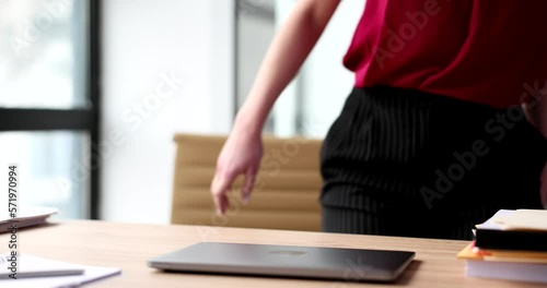 Businesswoman manager sit down at table in office
