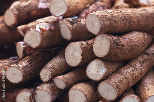 Stack of cassavas on a market stall photo