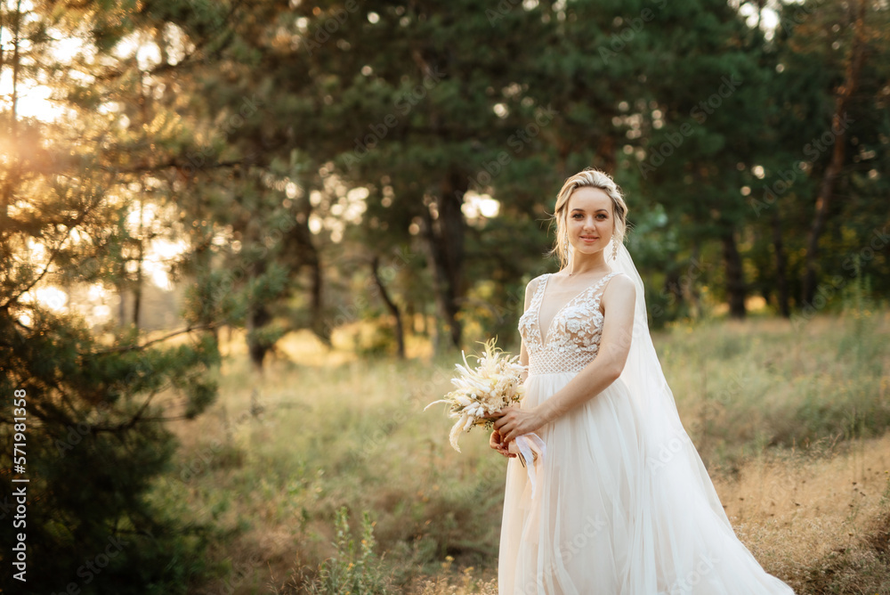 bride blonde girl with a bouquet in the forest bride blonde girl with a bouquet in the forest