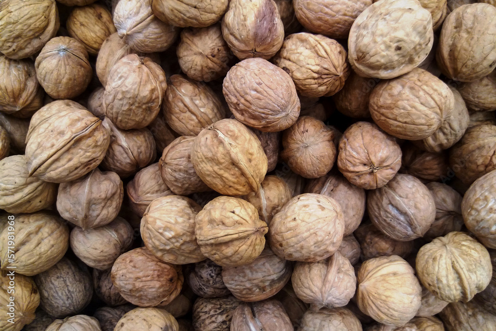 Stack of walnuts on a market stall Stack of walnuts on a market stall