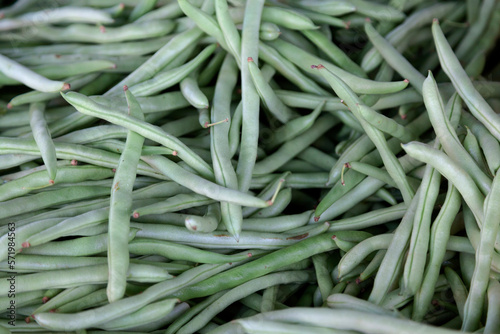 Stack of green beans on a market stall