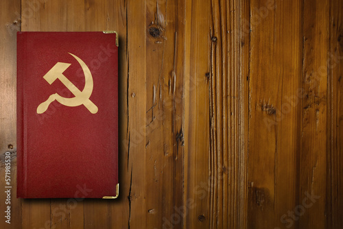 Fotografi Communist book on a wooden desk