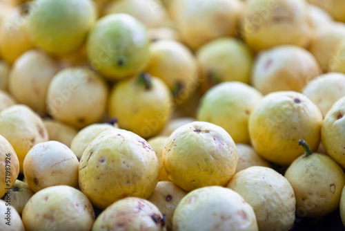 Stack Yellow Guavas on a market stall