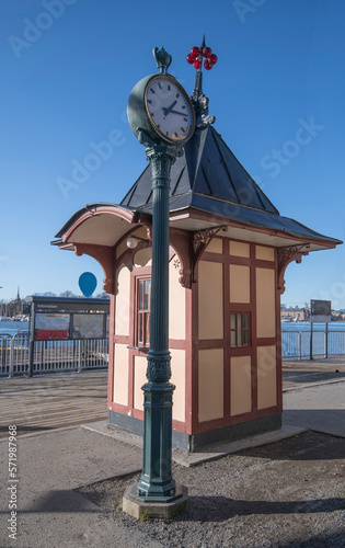Old kiosk for buying tokens to the harbor commuting ferries, a sunny winter day in Stockholm