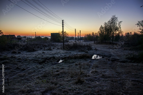 A frosty dawn on a meadow near the Horyn River. photo