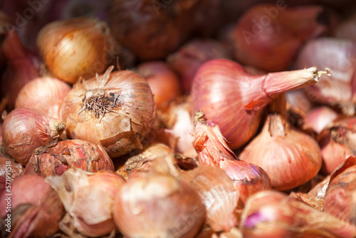 Stack of onions on a market stall
