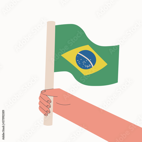 Brazilian flag. Hand holds national flag of the country. Vector cartoon illustration.