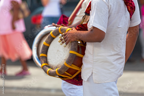 Canvas Print Musician playing with a Thavil during a Tamil procession
