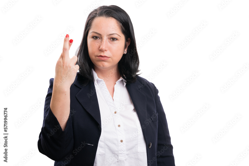 Female entrepreneur serious expression holding fingers crossed Female entrepreneur serious expression holding fingers crossed