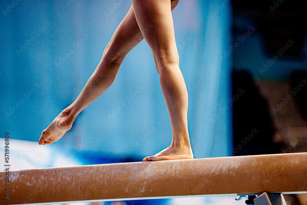 balance beam exercise legs young woman gymnast athlete Stock Photo