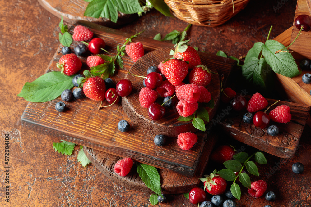Assorted fresh berries with leaves. Assorted fresh berries with leaves.