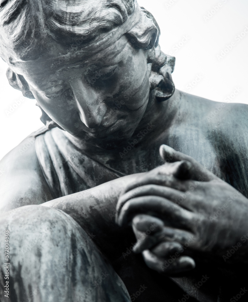 An abstract image of an angel praying for us and giving hope and help in desperate situations and suffering