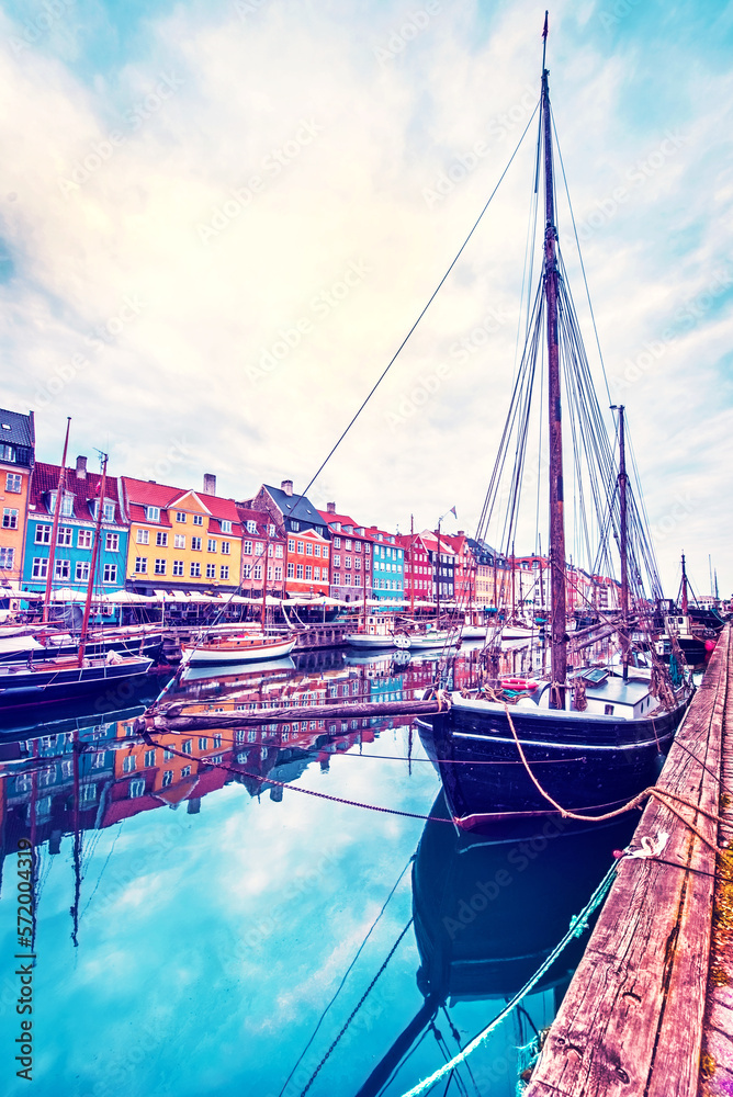 magical fascinating landscape with boat in a famous Nyhavn in the capital of Denmark Copenhagen. Exotic amazing places. Popular tourist atraction.