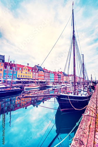 Obraz na płótnie magical fascinating landscape with boat in a famous Nyhavn in the capital of Denmark Copenhagen. Exotic amazing places. Popular tourist atraction. w salonie