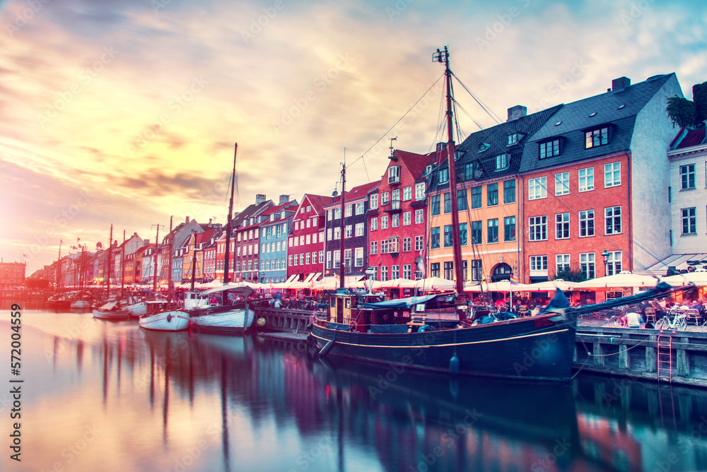 magical fascinating landscape with famous Nyhavn in the capital of Denmark Copenhagen at sunset. Exotic amazing places. Popular tourist atraction.