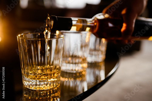 Barman Filling Glass Of Alcohol