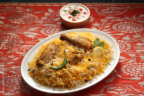 bombay biryani in white plate, Traditional spicy indian food, Iftar meal, Ramadan dinner on white background. 