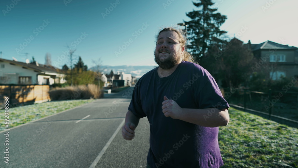 Fototapeta premium Happy man dancing in street. A cheerful fat chubby guy dancer celebrates life. Funny laid bad person