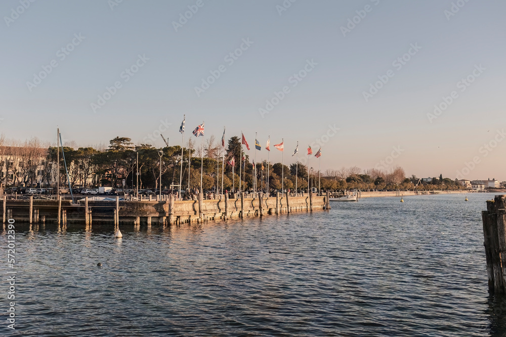 Breathtaking Sunset Landscape in Sirmione: A Perfect View of the Coast and Pier