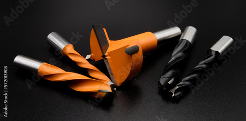 Woodworking  router bit. Rotating cutting tool. Professional cutting tools used for woodworking.
Stainless Drill bit. photo