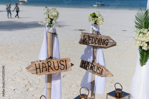 Sun-kissed beach wedding reception in Zanzibar adorned with beautiful decor