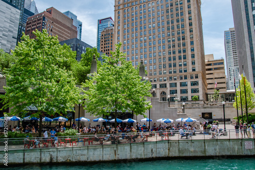 Outdoor Patio Restaurant With Umbrellas Along Chicago River