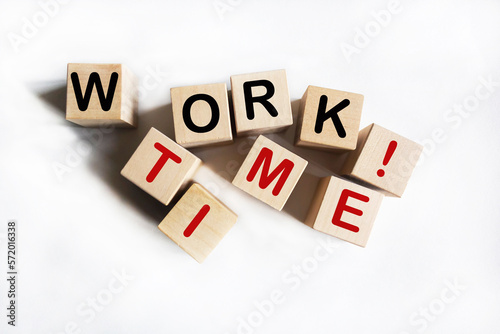 Work Time text on wooden blocks lying on a white background. Business