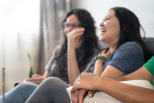 friends smiling on the sofa