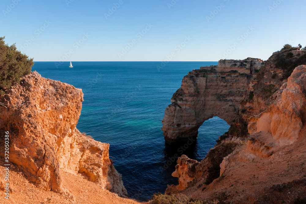 Landscape of the rocky coast of the Algarve - Portugal in the evening