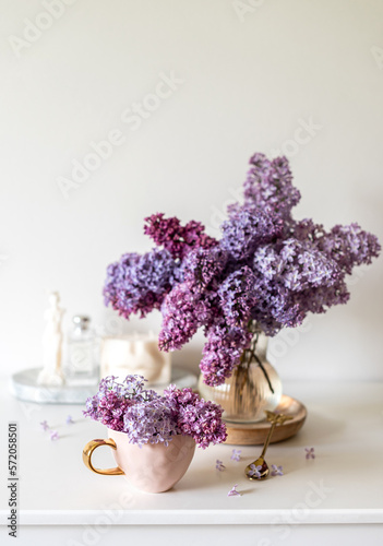 Naturals soy candle, cup with cappuccino, spring flowers lilac, woman's day