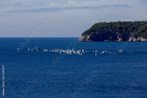 sailboats compete in a sailing regatta, sailboat race, the island is in the background, sunny day, clear weather, intense blue. Adriatic Sea, Dubrovnik, Croatia