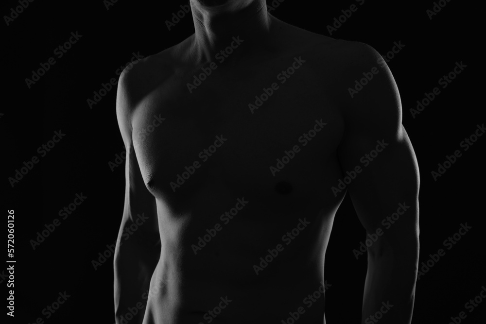 Shirtless muscular male body. Black and White Low Key Photography Shirtless muscular male body. Black and White Low Key Photography