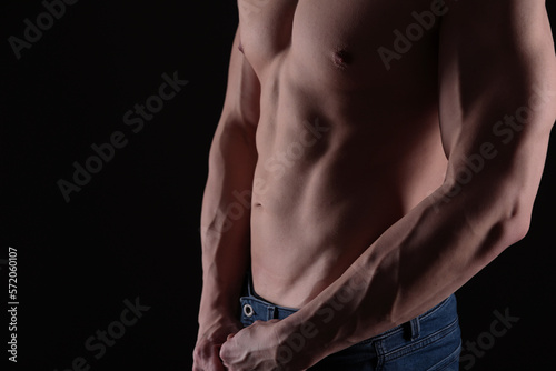 Muscular male body hair removal. Six pack abs close up