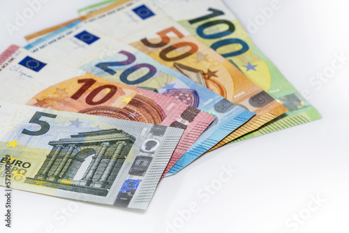 Some banknotes in euro currency on a light gray background, finance concept, copy space, selected focus, narrow depth of field