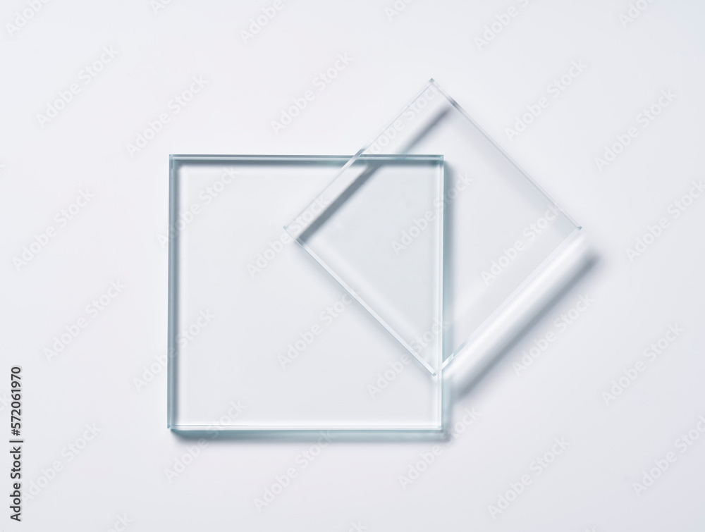 Glass square shapes on a light background.
