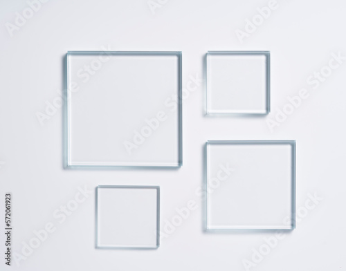 Glass square shapes on a light background.
