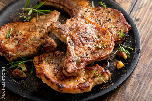 Pork chops grilled or seared bone in on a serving plate