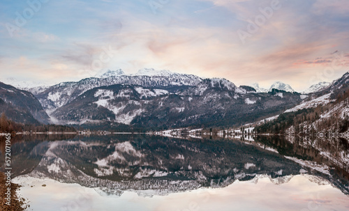 Winter dusk Alpine lake Grundlsee panorama (Austria) with fantastic pattern-reflection on the water surface.