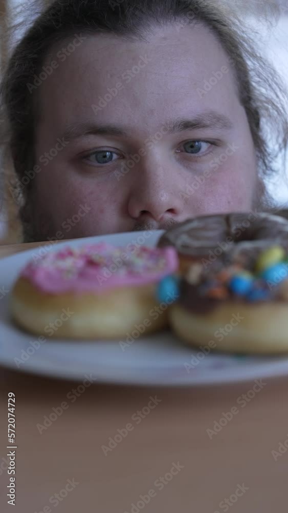overweight-person-wanting-to-eat-sugar-food-on-plate-one-young-fat-man