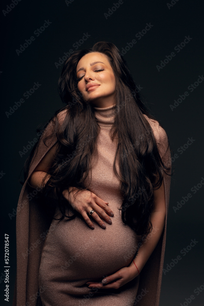 Fashion photo of a pregnant woman.Pregnancy, motherhood, preparation and waiting for childbirth Fashion photo of a pregnant woman.Pregnancy, motherhood, preparation and waiting for childbirth