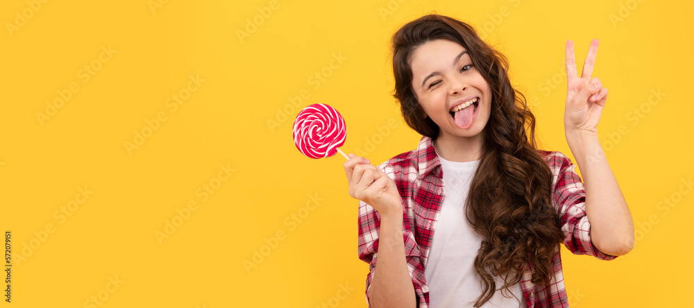 hipster kid with long curly hair hold lollypop. sugar candy on stick. caramel candy shop. Teenager child with sweets, poster banner header, copy space. hipster kid with long curly hair hold lollypop. sugar candy on stick. caramel candy shop. Teenager child with sweets, poster banner header, copy space.