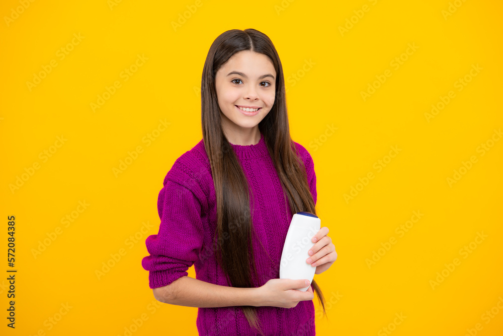 Teenage girl with shampoos conditioners or shower gel. Kids hair care cosmetic product, shampoo bottle. Teenage girl with shampoos conditioners or shower gel. Kids hair care cosmetic product, shampoo bottle.