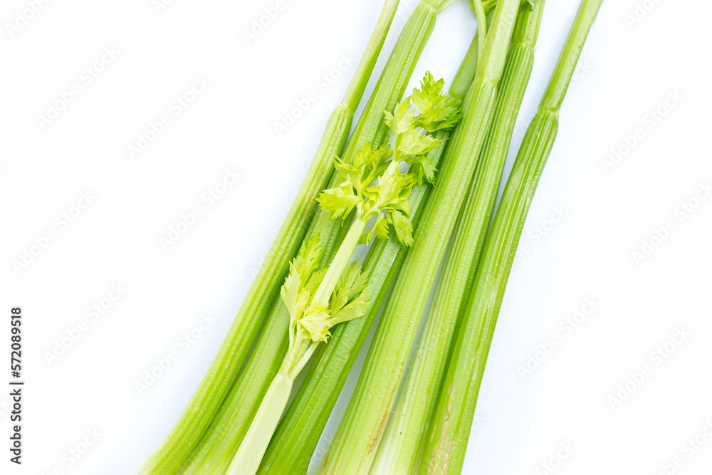 Obraz premium Fresh celery on white background. Top view