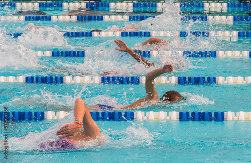 Swimming in pool with lanes