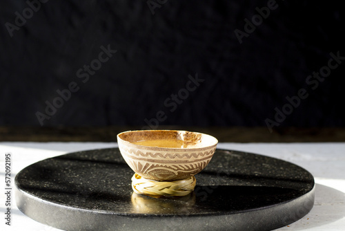 shot of mezcal or tequila in traditional artisan glass photo