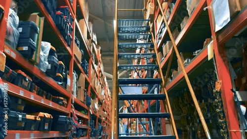 Shelves with goods and tools for home and repair in the warehouse of the DIY store